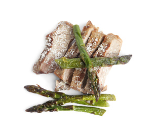 Photo of Tasty meat with asparagus isolated on white, top view