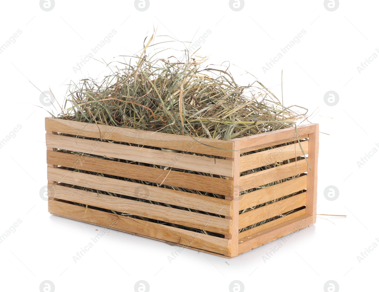 Photo of Dried hay in wooden crate isolated on white