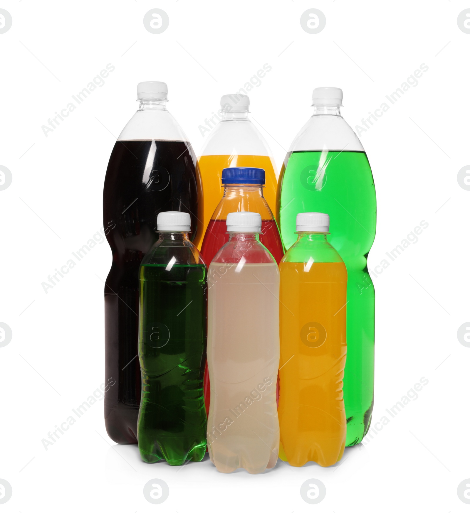 Photo of Bottles of soft drinks on white background