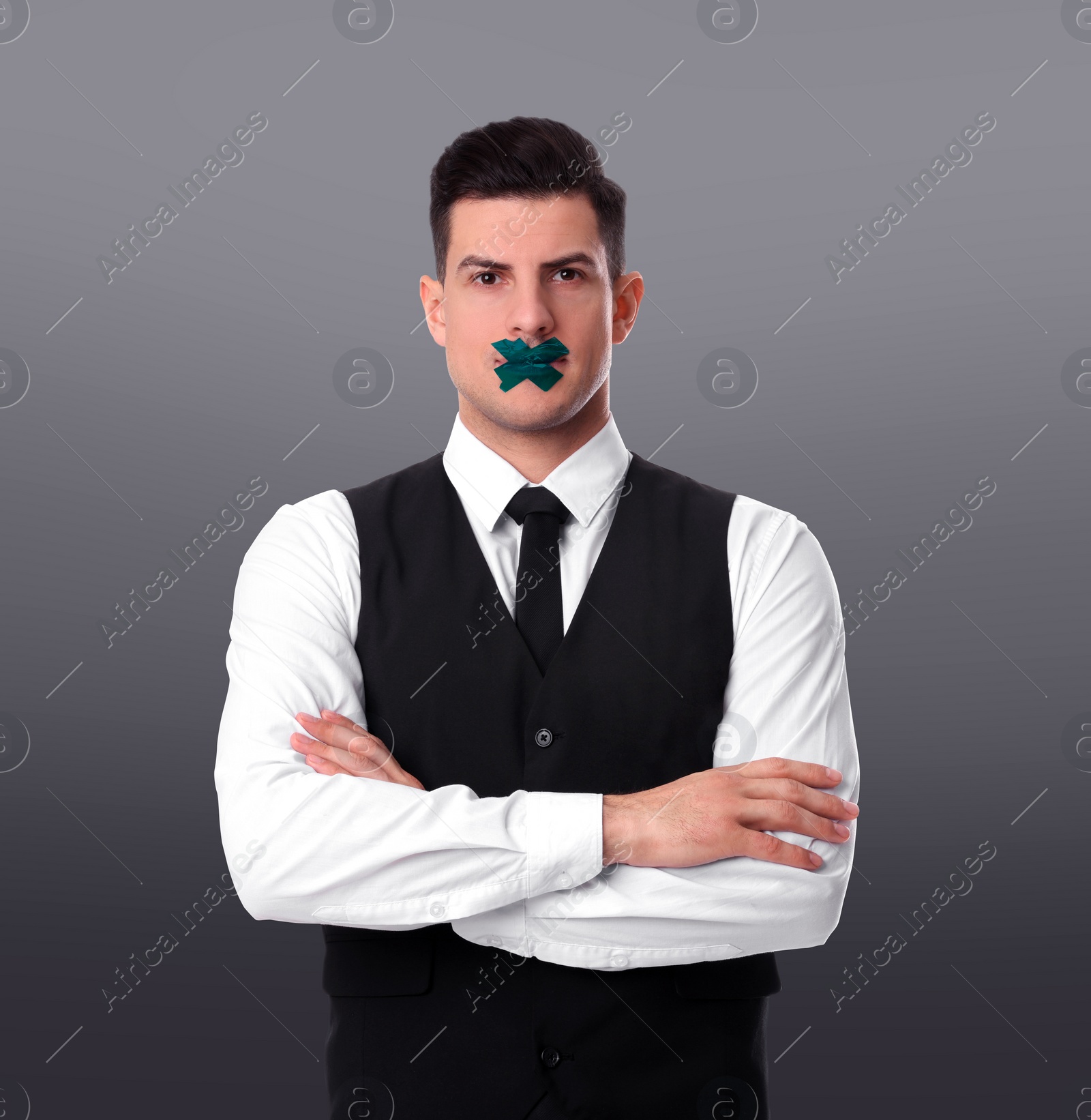 Image of Man with taped mouth on light grey background. Speech censorship