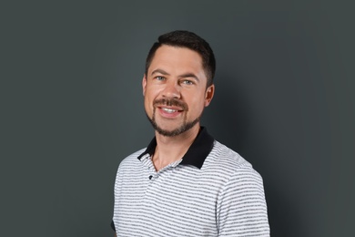 Portrait of handsome man on dark background