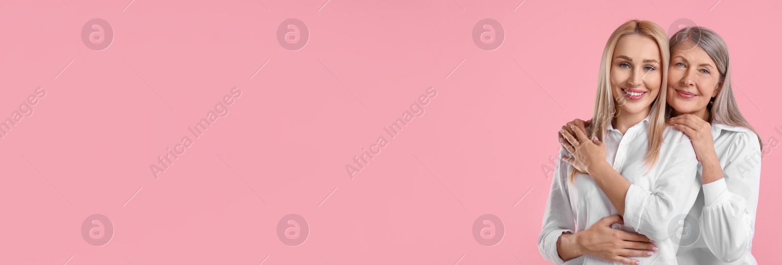 Image of Happy mother and daughter on light pink background, space for text. Banner design