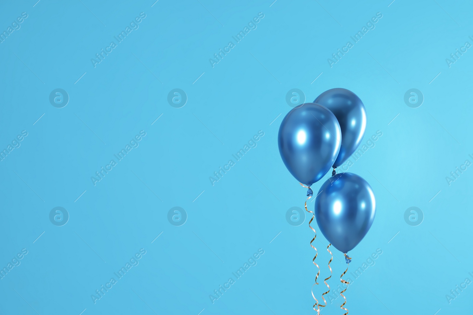 Photo of Bright balloons on color background. Space for text