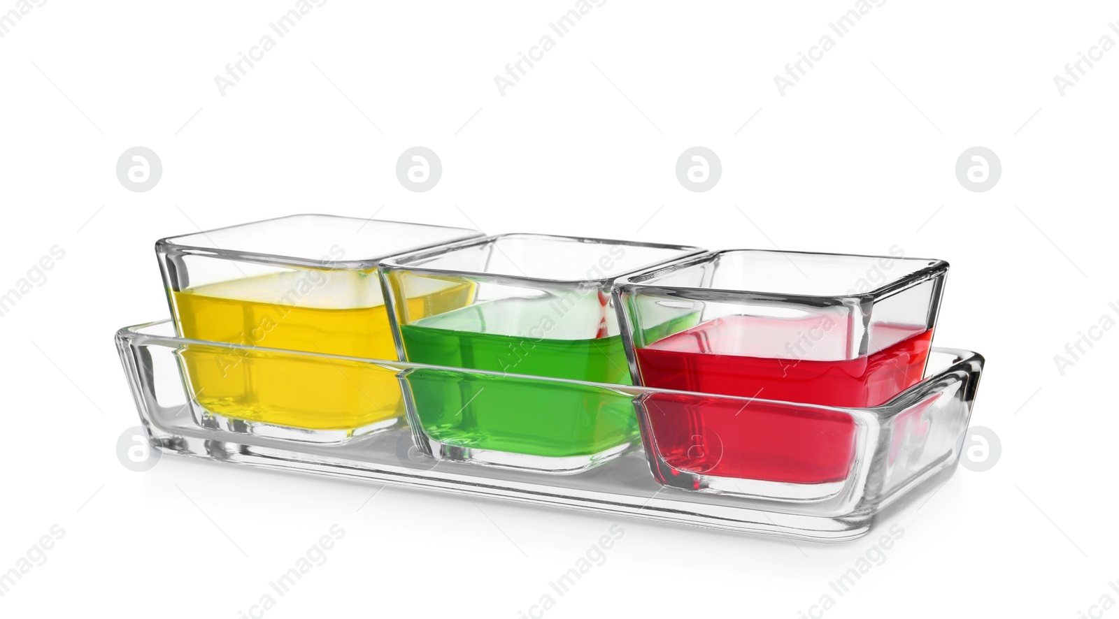 Photo of Tasty jelly desserts in glass bowls on white background