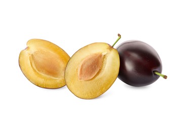 Photo of Whole and cut ripe plums on white background