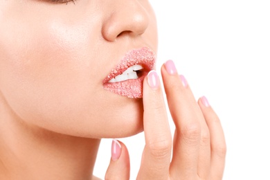 Photo of Young woman with sugar lips on white background, closeup