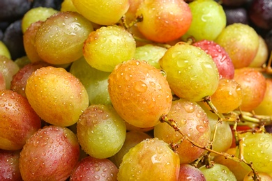 Photo of Fresh ripe juicy grapes as background, closeup