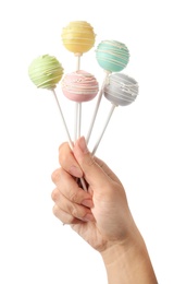 Woman holding sweet cake pops on white background, closeup