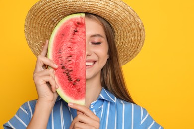 Photo of Beautiful girl with slice of watermelon on yellow background