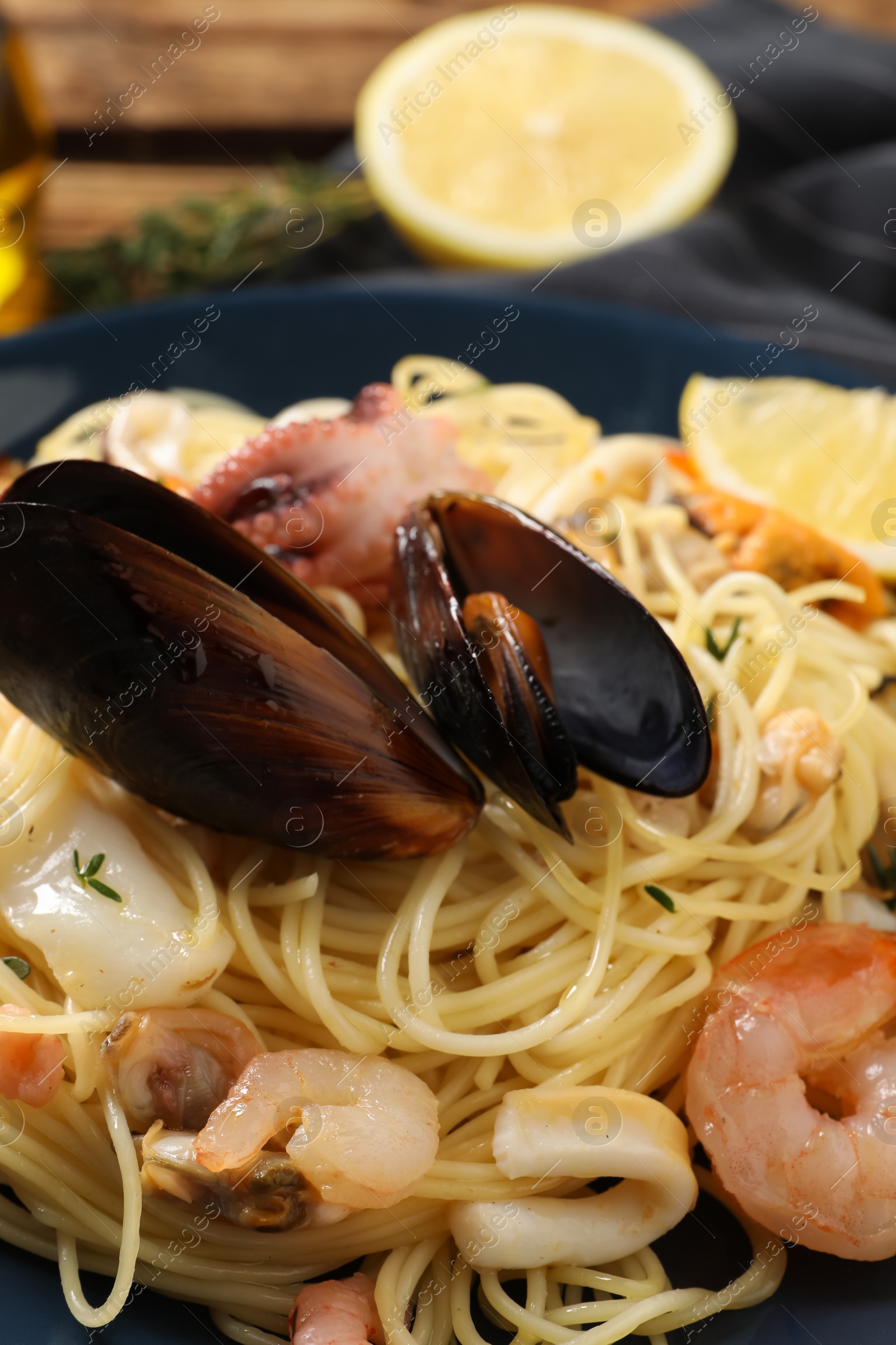 Delicious pasta with sea food on table, closeup Photo of Delicious pasta with sea food on table, closeup