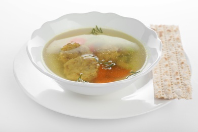 Photo of Bowl of Jewish matzoh balls soup isolated on white