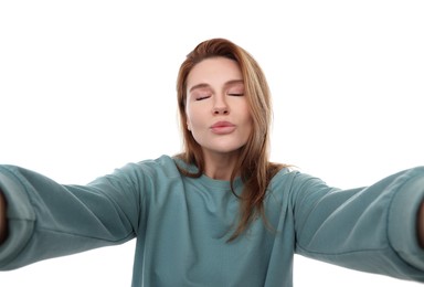 Photo of Beautiful woman taking selfie on white background