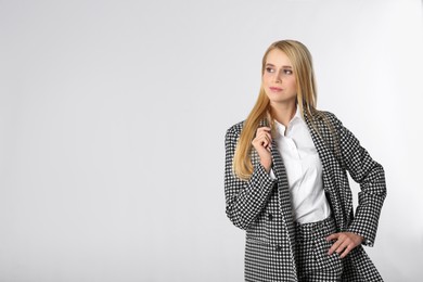 Photo of Portrait of young businesswoman on white background. Space for text