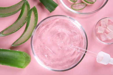 Photo of Flat lay composition with aloe vera leaves and cosmetic gel on pink background