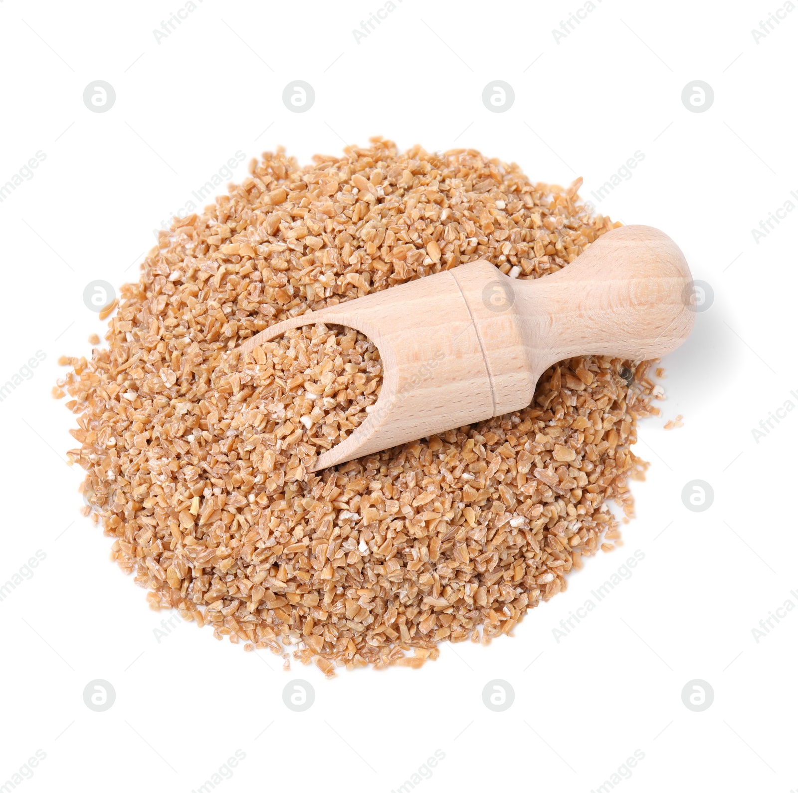 Photo of Pile of dry wheat groats and scoop isolated on white, top view