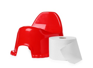 Photo of Red baby potty and toilet paper on white background