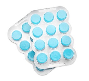 Photo of Blisters with blue cough drops on white background, top view