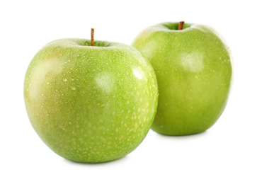 Photo of Fresh juicy green apples with water drops isolated on white