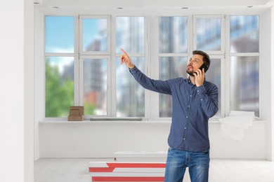 Photo of Man talking on phone in apartment during repair, space for text