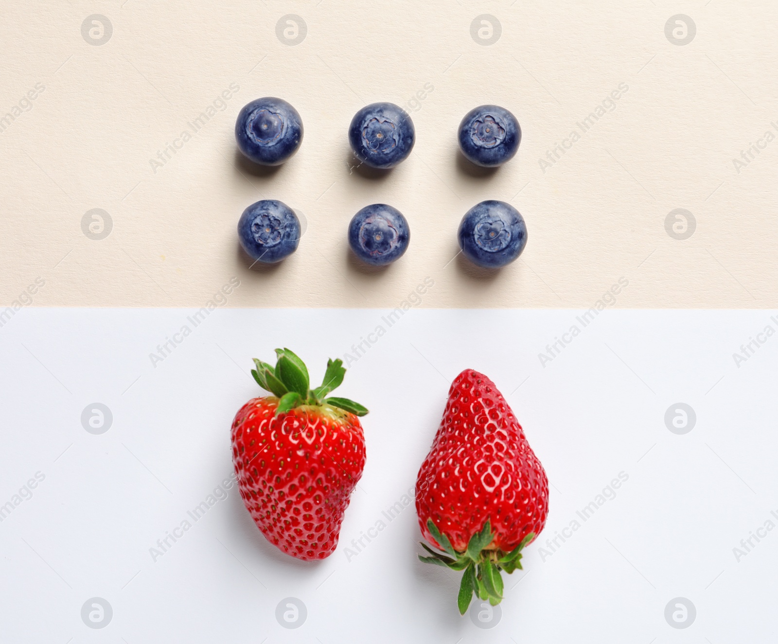 Photo of Flat lay composition with fresh berries on color background