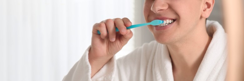 Image of Man brushing his teeth with toothbrush, closeup. Banner design with space for text