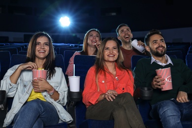 Photo of Young people watching movie in cinema theatre