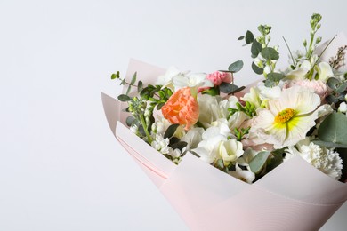 Photo of Bouquet of beautiful flowers on white background, closeup. Space for text