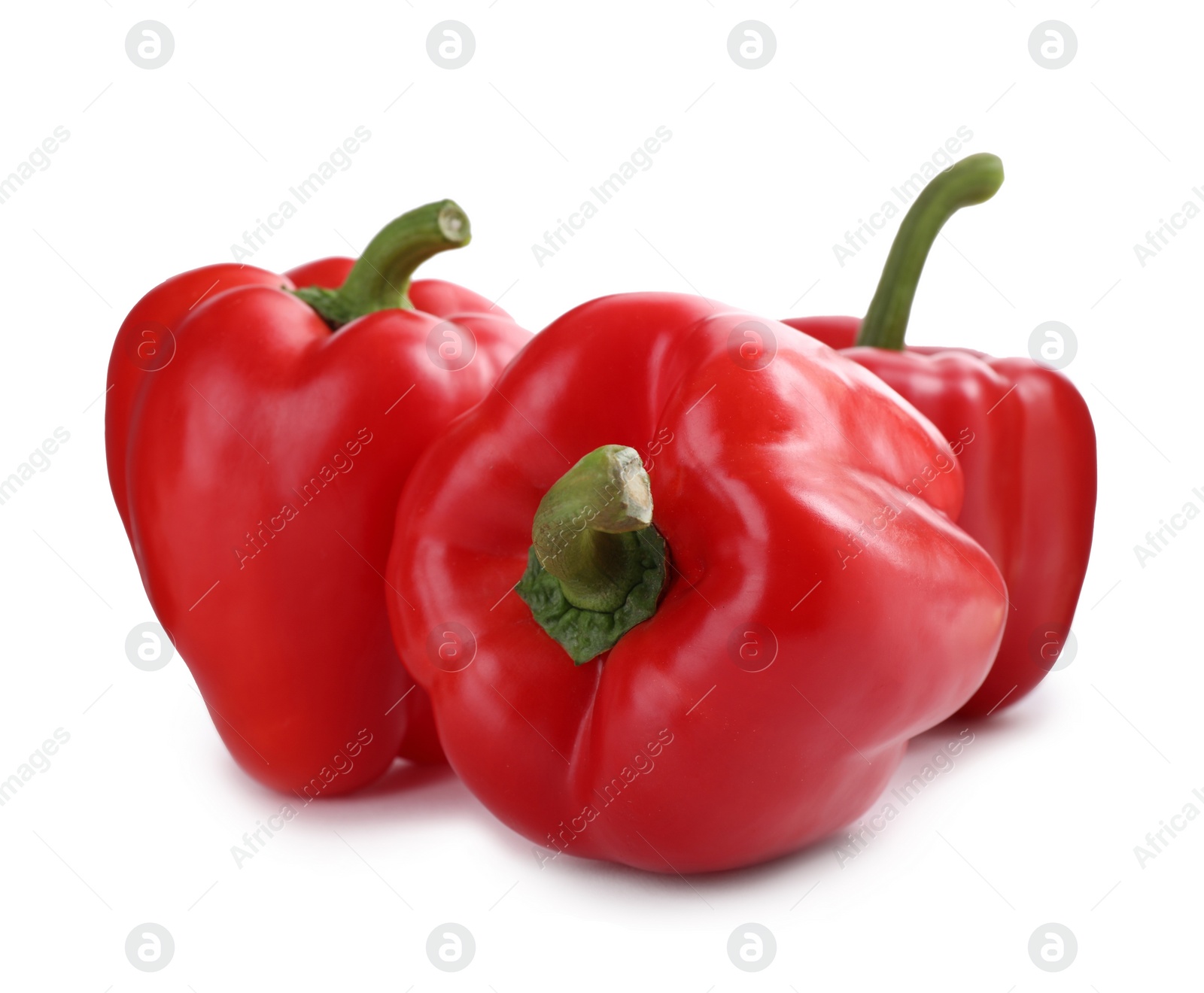 Photo of Ripe red bell peppers isolated on white