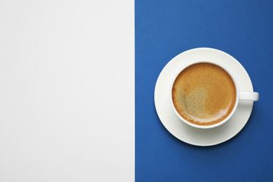 Photo of Black coffee on bright background, top view with space for text. Color of the year 2020 (Classic blue)