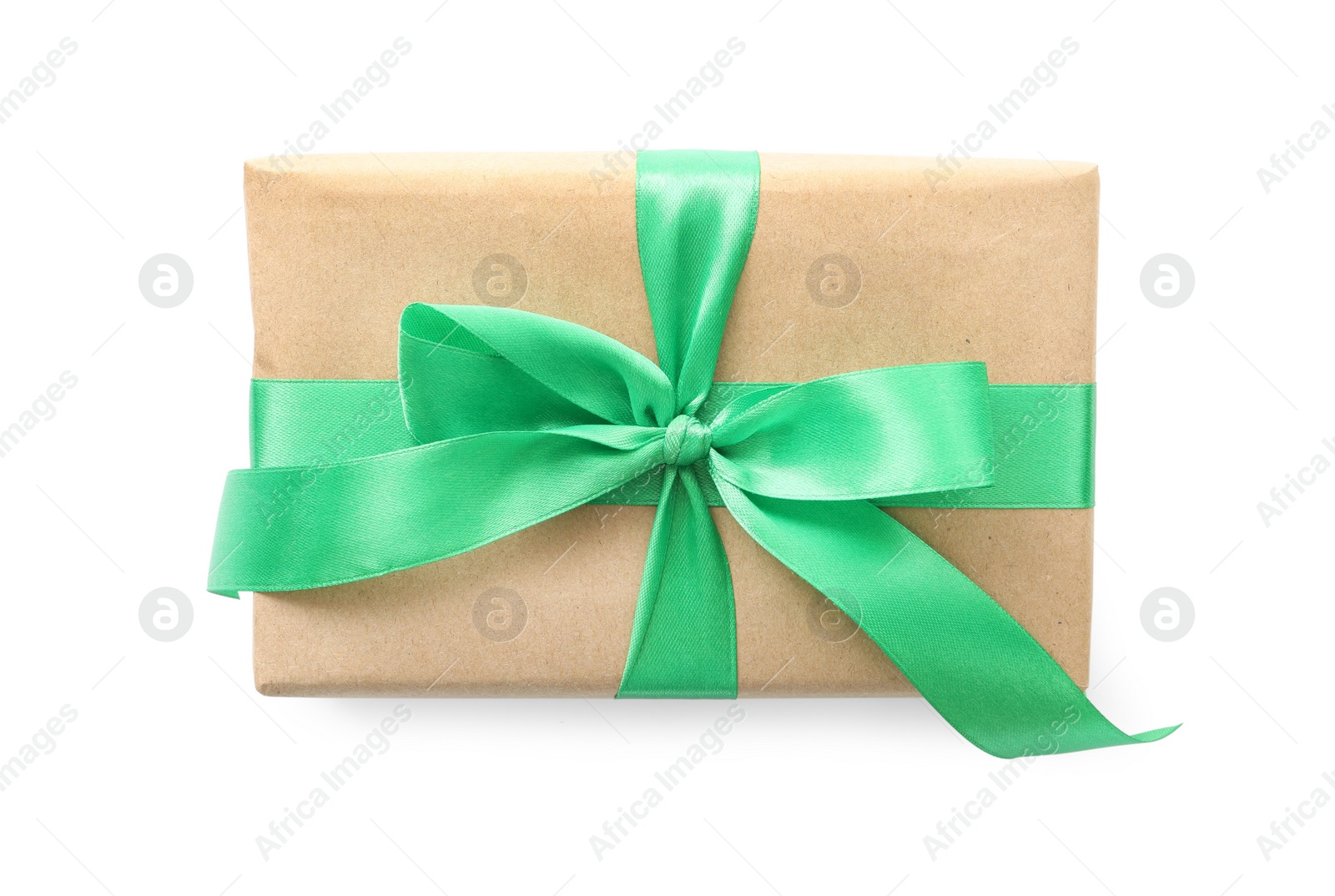 Photo of Christmas gift box decorated with green bow isolated on white, top view