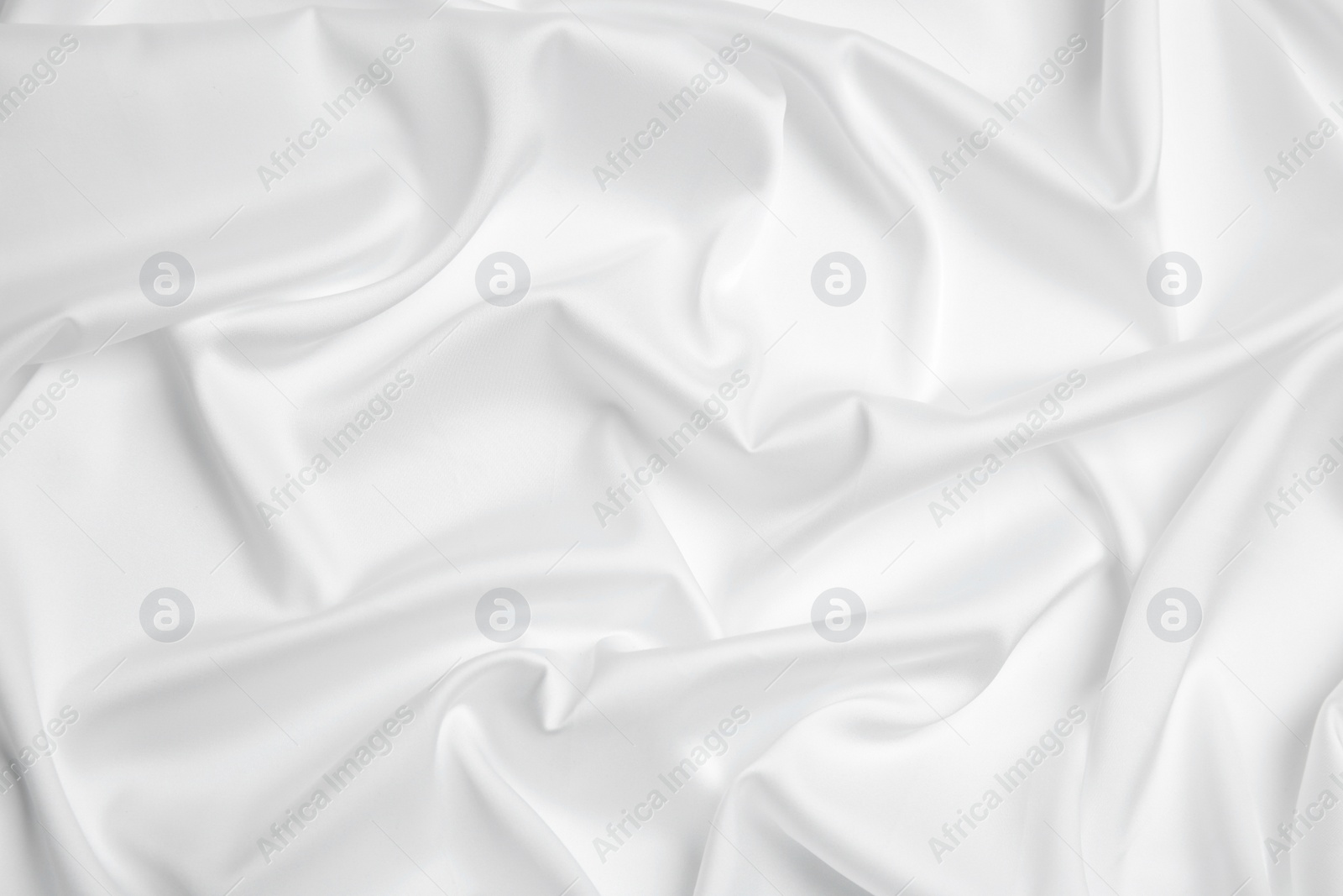 Photo of Texture of delicate white fabric as background, top view