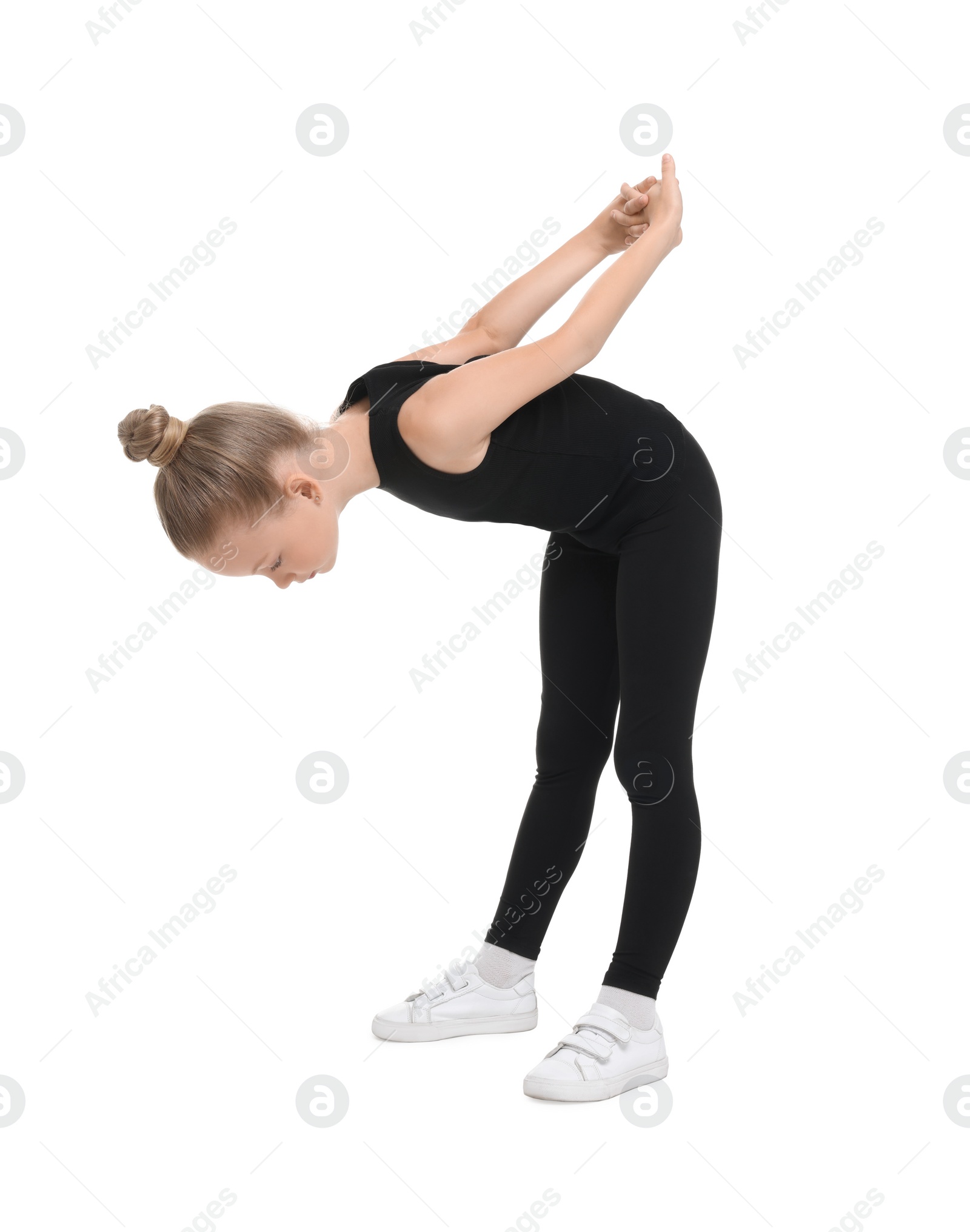 Photo of Little girl doing morning exercise on white background