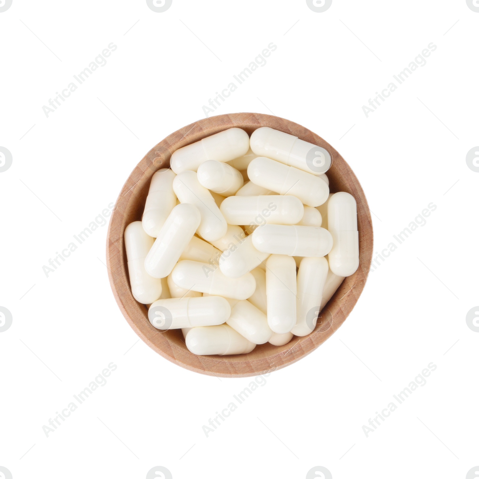 Photo of Vitamin capsules in wooden bowl isolated on white, top view