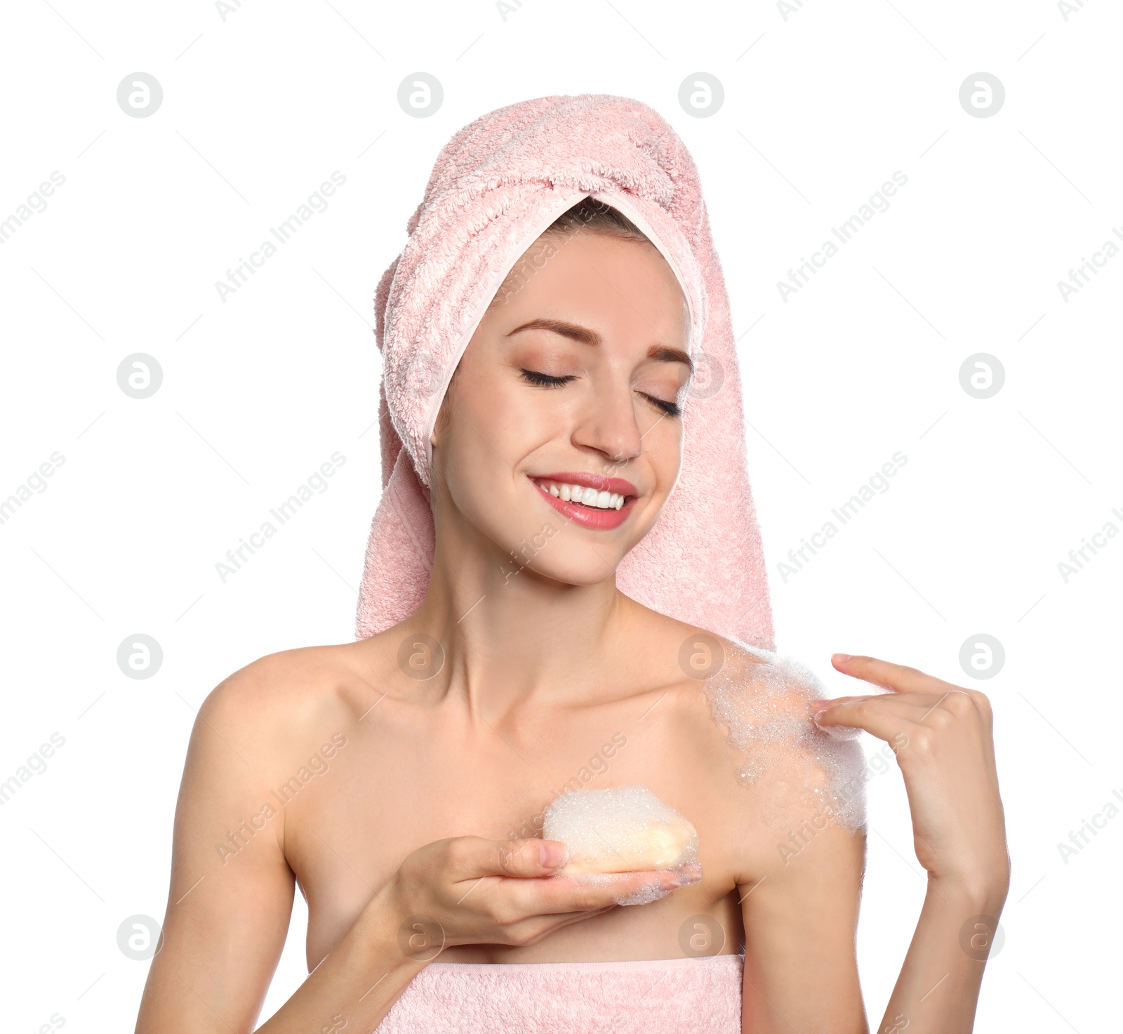 Image of Young woman washing body with soap bar on white background