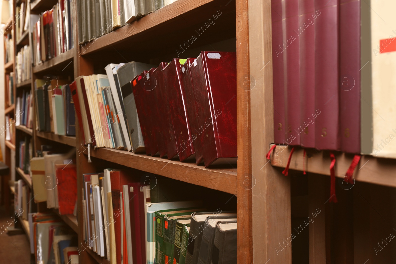 Image of Collection of different books on shelves in library