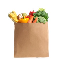 Photo of Fresh vegetables in paper shopping bag on white background