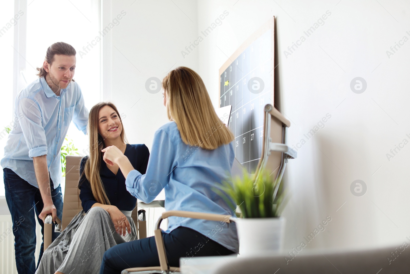 Photo of Young people having business training in office