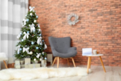 Photo of Blurred view of stylish living room interior with decorated Christmas tree