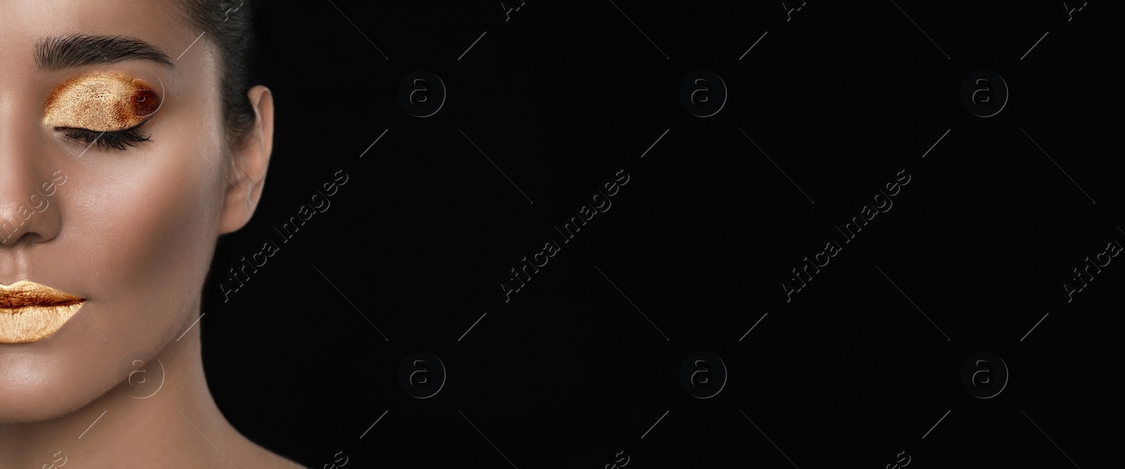 Image of Young woman with beautiful gold makeup on black background, closeup. Banner design with space for text