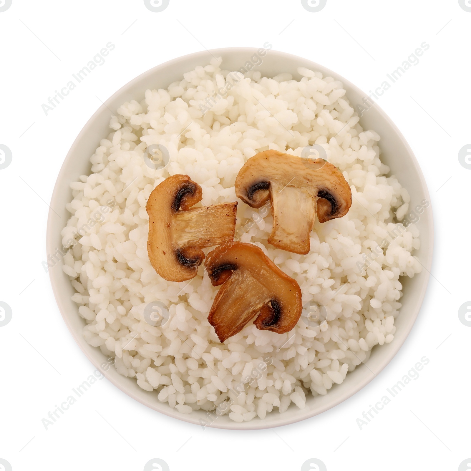 Photo of Delicious rice with mushrooms in bowl isolated on white, top view