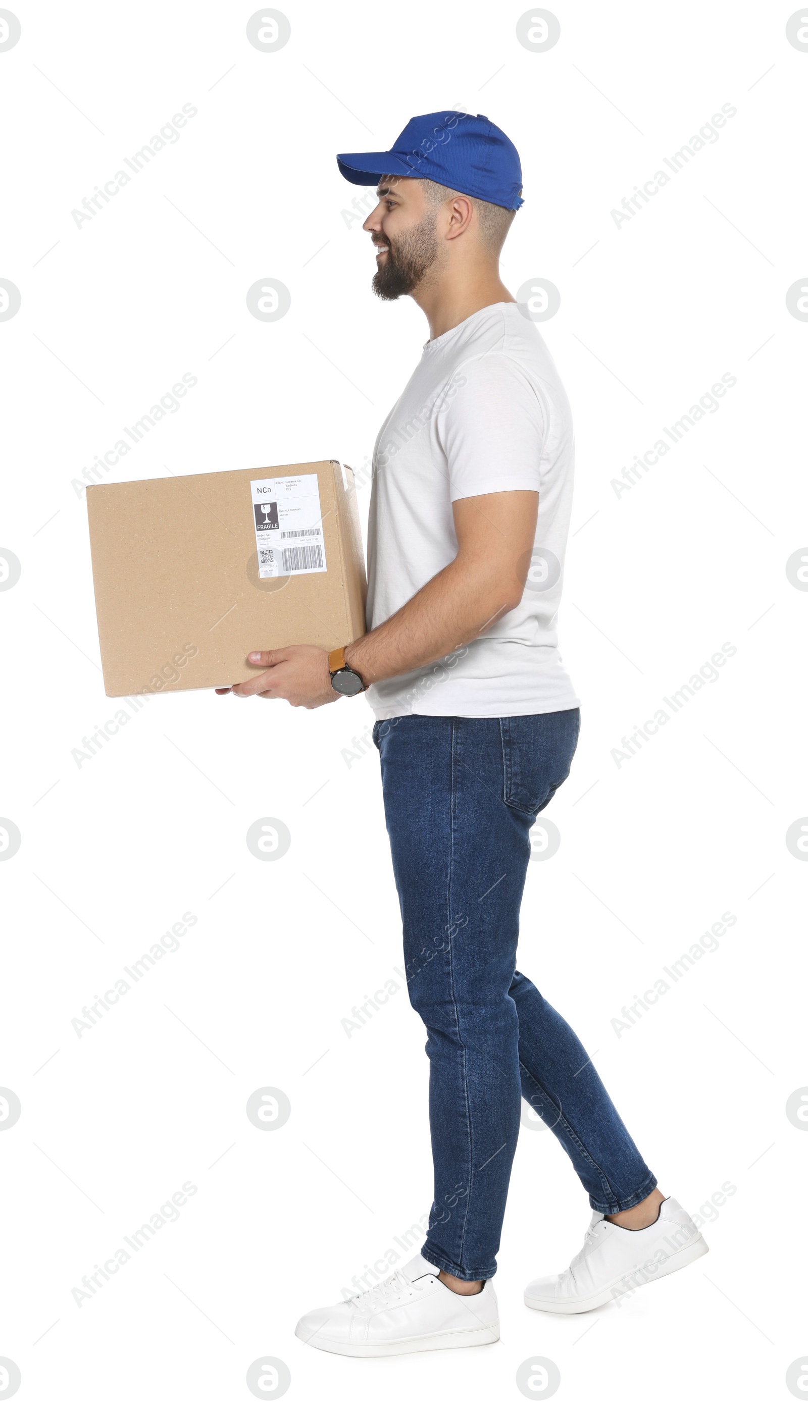 Photo of Happy young courier with cardboard box on white background