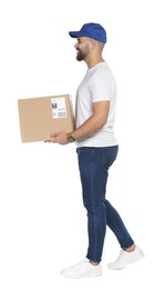 Happy young courier with cardboard box on white background