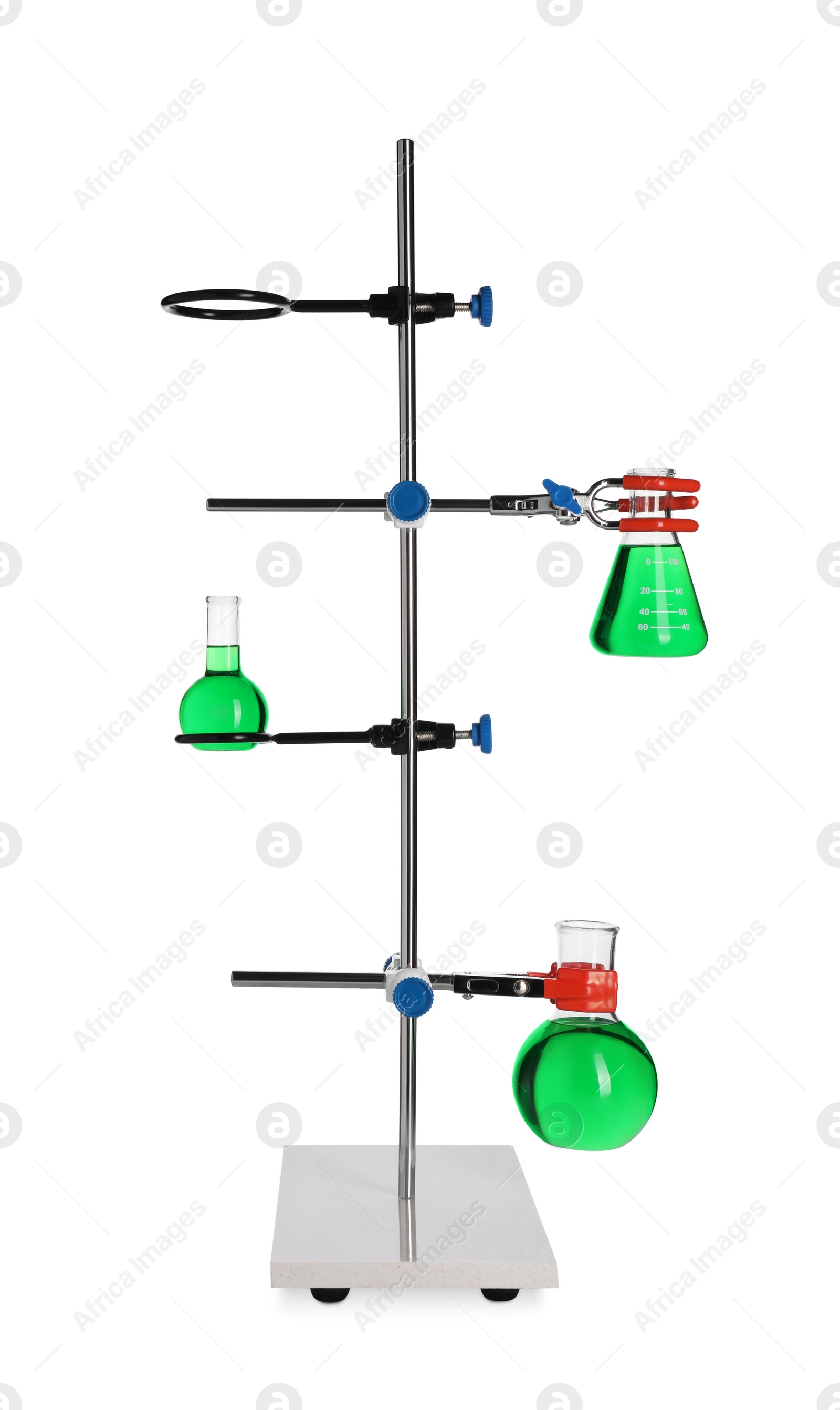 Photo of Retort stand with flasks of green liquid isolated on white