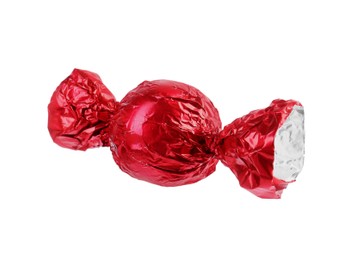 Tasty candy in red wrapper isolated on white