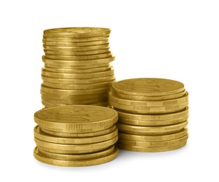 Photo of Many golden coins stacked on white background