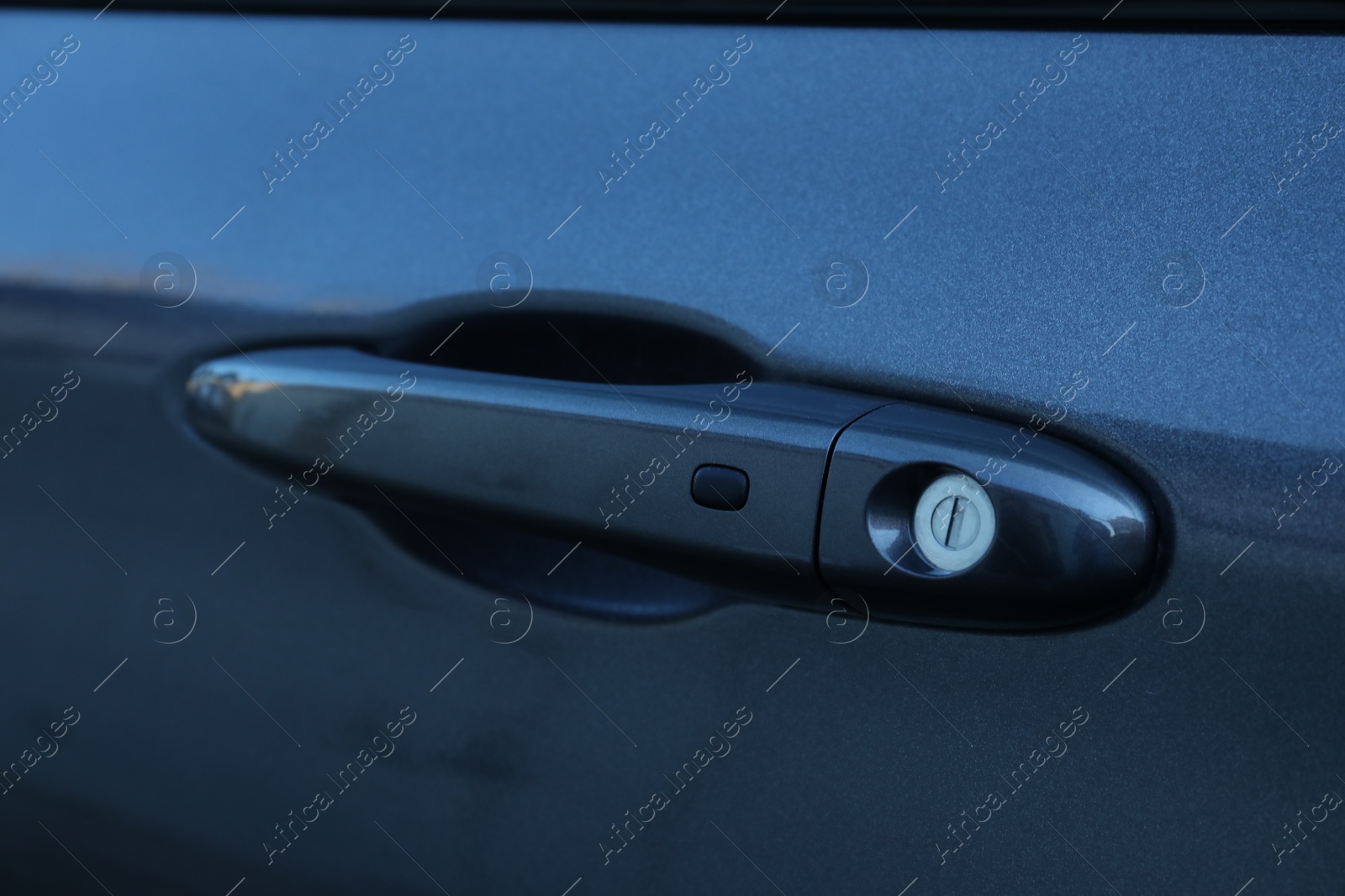 Photo of Closeup view of car door with handle