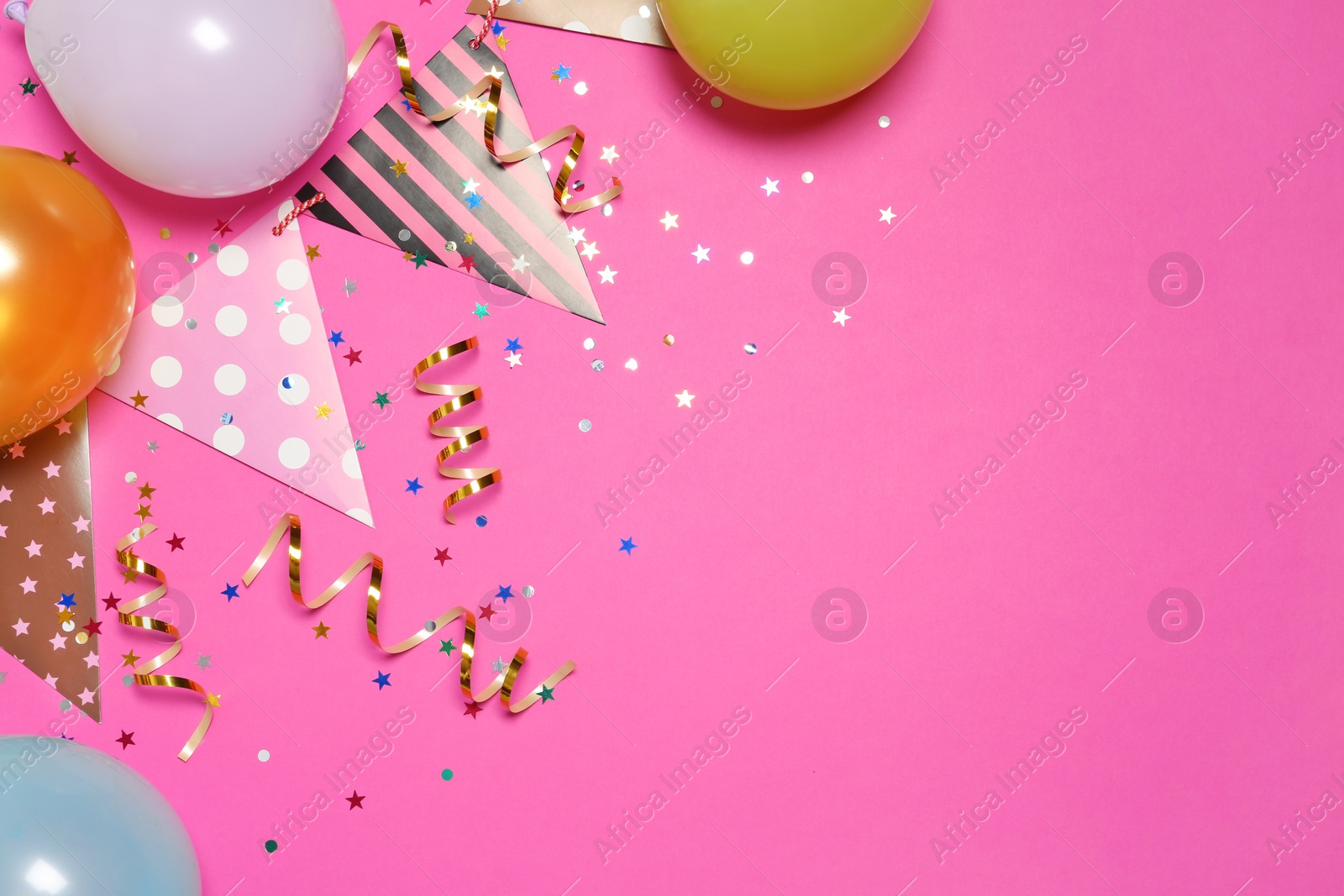 Photo of Flat lay composition with balloons and party accessories on color background, space for text