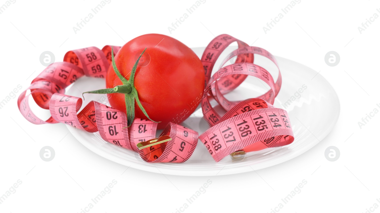 Photo of Measuring tape, plate and fresh tomato isolated on white. Diet concept