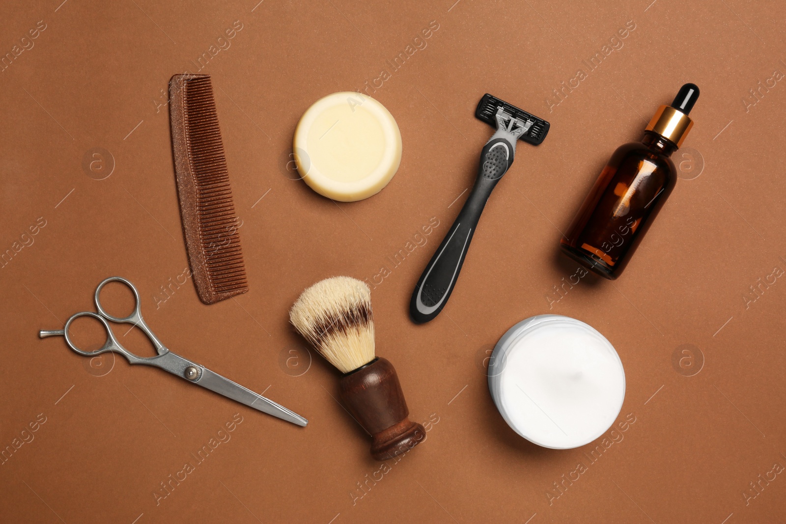 Photo of Set of men's shaving tools on brown background, flat lay