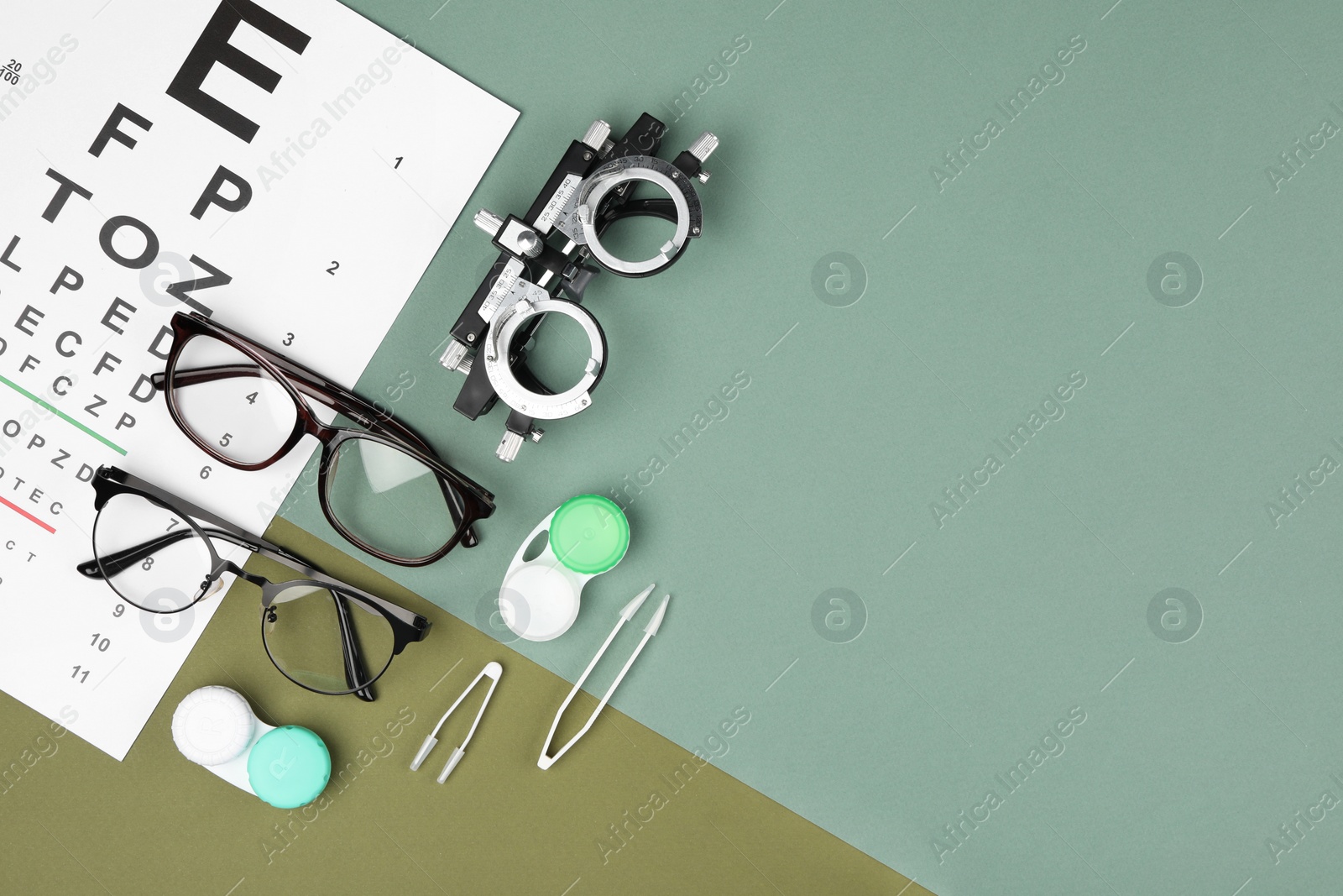 Photo of Flat lay composition with vision test chart and glasses on color background, space for text